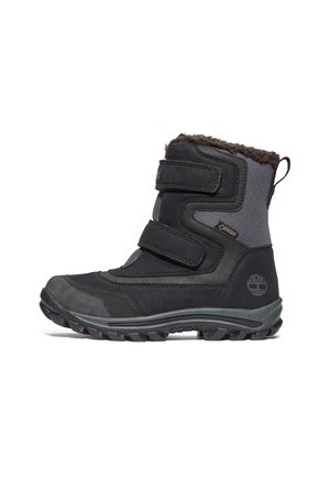 Black winter boot with synthetic upper, two adjustable straps, fur-lined collar, and textured rubber sole for traction.