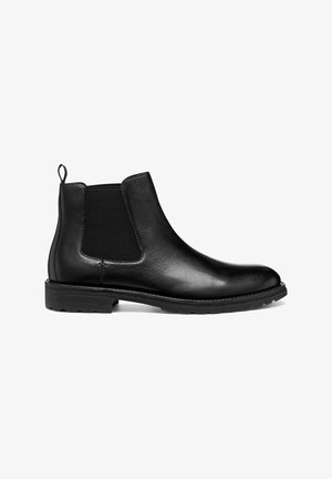 Stivale Chelsea in pelle nera con pannelli elastici laterali e linguetta per indossarlo. Finitura liscia, punta arrotondata e suola in gomma resistente.