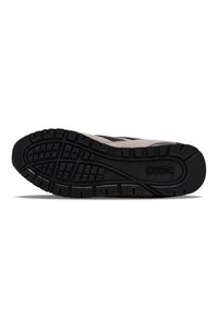 Black rubber outsole with deep treads, featuring a beige upper in a mix of textures.  Hummel logo embossed on the side.