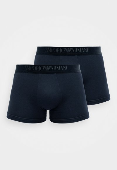 Temno modri bokserice z mehkim elastčnim pasom, ki vsebuje logo Emporio Armani, gladko teksturo in klasičen prilega obliko.