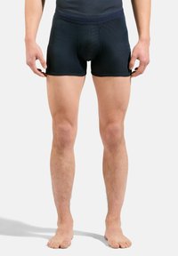 Un caleçon en bleu marine foncé, en tissu texturé, présentant un design ajusté et une taille lisse, sans motifs ni éléments visibles.