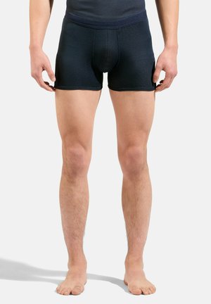 Un caleçon en bleu marine foncé, en tissu texturé, présentant un design ajusté et une taille lisse, sans motifs ni éléments visibles.