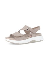 Suede beige sandals with a double strap design, adjustable buckle, and a white cushioned sole. Rounded toe and textured upper.