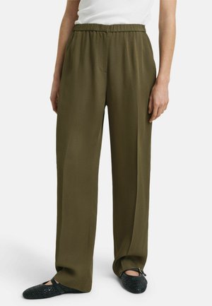 Olive green, wide-leg pants with an elastic waistband and a single front pocket, made from a smooth, lightweight fabric.