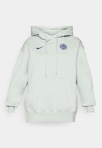 Lys grøn hettegenser med en stor frontlomme, snor og ribbestrikkede ermer. Har en blå Nike-logo og et rundt blått emblem på brystet.