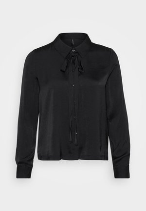 Sort langærmet bluse lavet af glat stof. Har en krave, knaplukning foran og en sløjfe-accent ved halsudskæringen. Simpelt design.
