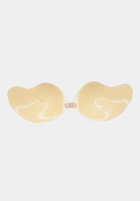 Reggiseno adesivo senza spalline e senza schienale con chiusura frontale, colore beige e coppe a forma di ala con superficie testurizzata.