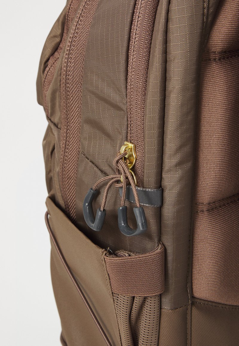 north face gold zipper backpack Borealis Mini it has since become a classic on campus and on the job Women's The North Face Recon