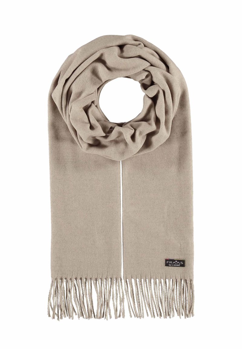 Beige kudumaterjalist sall, millel on ringikujuline muster ja pikad fringed ääred. Alläärel on väike silt, millel on brändi nimi.