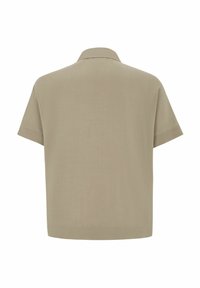 Kortærmet skjorte i lys beige, med en blød tekstur, afslappet pasform og klassisk krave. Rent design uden synlig branding.