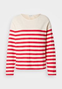 Sarkana un krēmgada lentes ar garām piedurknēm, apaļo kakla izgriezumu un brīvu piegriezumu. Tam ir horizontālas svītras un mīksta auduma tekstūra.