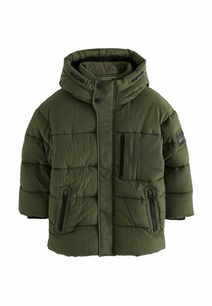 Giacca a vento in verde oliva, con cappuccio, tasche laterali con zip e tasca sul petto. Tessuto strutturato con pannelli cuciti.