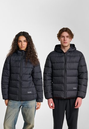 Black puffer jackets with a hood, featuring quilted sections, front zippers, and a logo on the left chest area. Worn by two models.