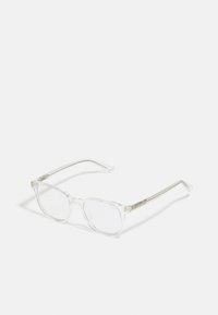 Lunettes en plastique transparent avec des verres ronds, monture transparente et logo discret sur les branches. Design léger et minimaliste.