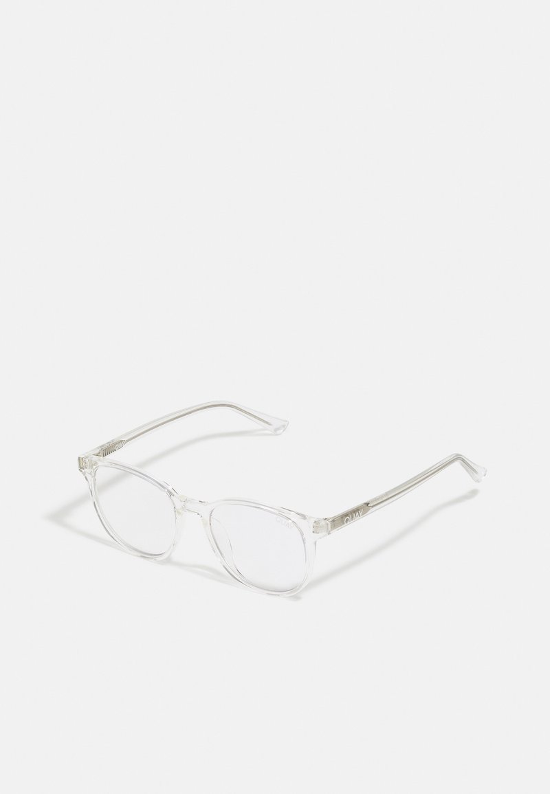 Lunettes en plastique transparent avec des verres ronds, monture transparente et logo discret sur les branches. Design léger et minimaliste.