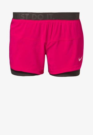 Pink running shorts with an elastic waistband featuring "JUST DO IT" text, layered over black inner shorts, made of lightweight fabric.