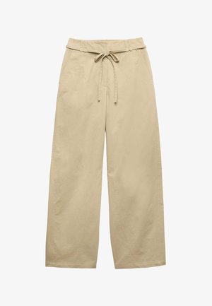 Béžové kalhoty s širokými nohavicemi, vysokým pasem, postranními kapsami a nastavitelným zavazovacím páskem vpředu, vyrobené z lehké látky.