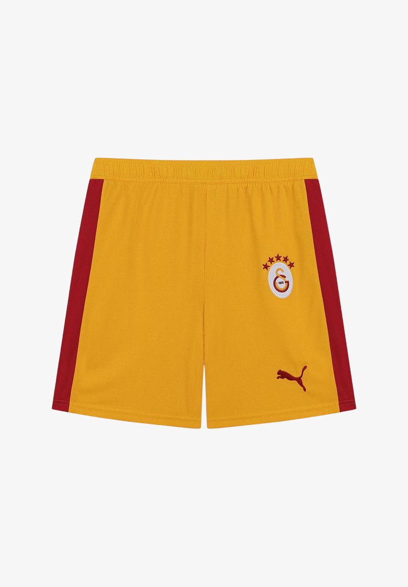 Żółte sportowe spodenki z czerwonymi pasami po bokach, z logo klubu piłkarskiego Galatasaray oraz logo Puma z przodu.