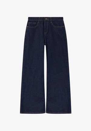 Tamsiai mėlynos pločio kojų džinsai su priekinių kišenių, diržo kilpelių ir sagos uždarymu juosmens srityje.