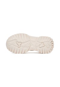 Suela de un zapato con una superficie texturizada de color beige claro, con surcos y crestas para mayor tracción, y un patrón distintivo para soporte.