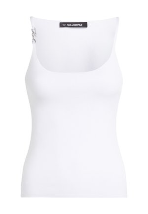 Canottiera bianca con scollatura a girocollo. Realizzata in tessuto testurizzato. Presenta spalline sottili e un'etichetta con marchio sul retro.