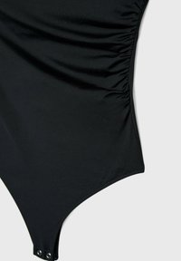 Black one-piece swimsuit featuring gathered side panels, smooth fabric texture, and snap closure at the bottom. Classic design and fit.