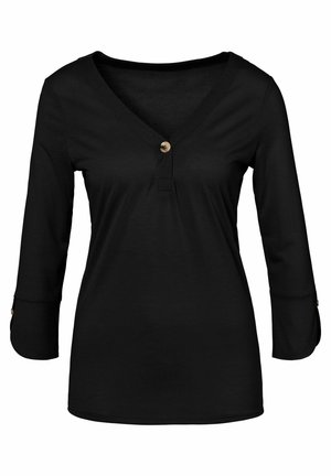 Black long-sleeve top with a V-neck, featuring a button detail at the neckline and button accents on sleeves. Made of soft fabric.