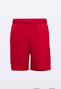 Punaiset urheilushortsit, jotka on valmistettu kevyestä kankaasta. Niissä on joustava vyötärönauha ja kiristysnyöri sekä musta Jordan-logo alareunan vasemmalla puolella.