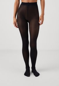 Schwarze blickdichte Strumpfhosen mit einer glatten Textur, im Vollformat-Design und einem breiten Bund. Das Material scheint dehnbar und figurbetont zu sein.