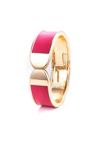 Gold-tone cuff bracelet featuring a bright pink leather inlay. The design has a smooth, polished finish with a sleek, curved shape.