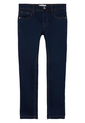 Vaqueros ajustados azul oscuro con botón frontal, cremallera, diseño de cinco bolsillos y costuras en contraste.