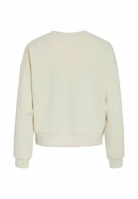 Sweat-shirt couleur crème avec une coupe décontractée, col rond et poignets côtelés. Texture lisse, design minimaliste, sans motifs ni accents visibles.