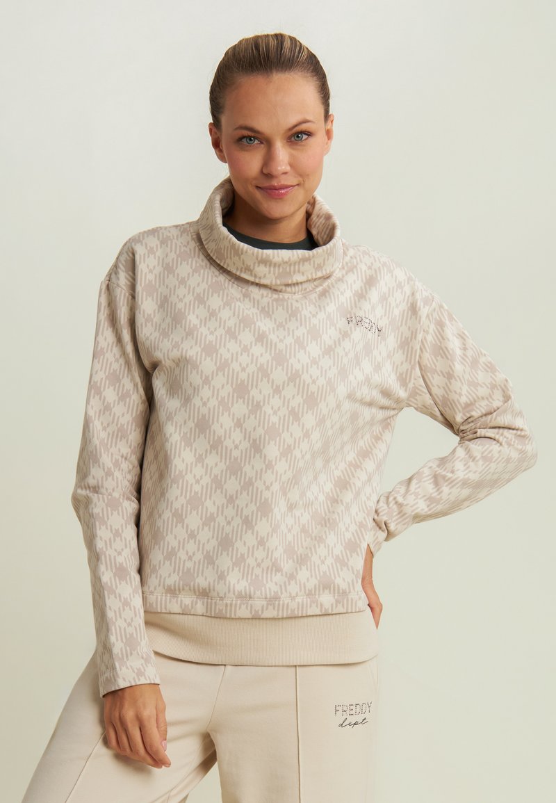Felpa beige con motivo, colletto alto, texture morbida e orlo a coste. Presenta il logo ricamato "Freddy" sul davanti.