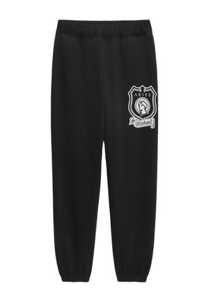 Schwarze Jogginghose mit elastischen Bündchen an Knöcheln und Bund, mit einem weißen Aries St. Michael Wappen am oberen linken Oberschenkel und Seitentaschen.