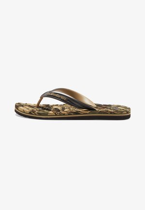 Brown flip-flop sandal featuring a camouflage patterned footbed, black rubber strap, and embossed logo on the strap. Textured sole for grip.