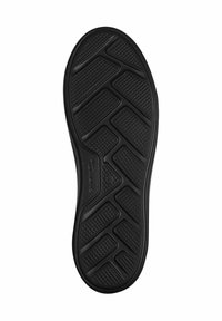 Semelle de chaussure en caoutchouc noir avec un motif de rainure en zigzag et une surface texturée pour une meilleure adhérence et durabilité. Logo embouti près du centre.