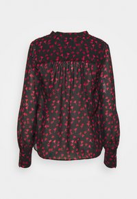 Blouse noire à motif floral rouge, manches longues, dos froncé et poignets boutonnés. Tissu léger et transparent avec une texture douce.