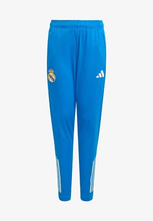 Niebieskie spodenki sportowe z lekkiego materiału. Posiadają białe paski Adidas oraz logo Realu Madryt na lewej udzie. Elastyczny pas.