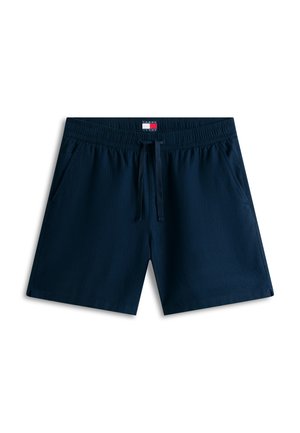 Muške tamnoplave kupaće hlače s elastičnim pojasom, vezicama, bočnim džepovima i logotipom Tommy Jeans na unutarnjem pojasu.