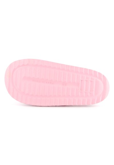 Suola di scarpa in gomma rosa con superficie testurizzata, caratterizzata da scanalature orizzontali e verticali, e un design della punta arrotondato.