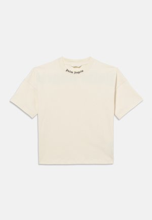 T-shirt à manches courtes couleur crème avec le texte "Palm Angels" imprimé en noir sur le col, présenté sur un fond blanc.