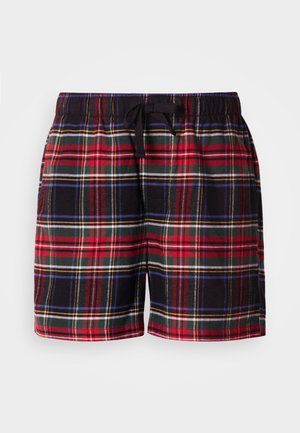 Plaidshorts med et mønster i sort, rød, grøn og blå. Elastisk taljebånd med snørre. Blødt stof, knælængde design.