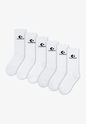 Six paires de chaussettes blanches montantes avec un logo Converse noir et un texte aligné horizontalement sur un fond blanc.