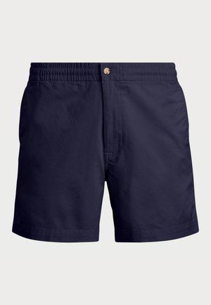 Marineblå badeshorts laget av lett stoff. Har elastisk midjebånd og frontlukking med en messingknapp. Enkel design.