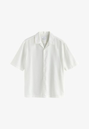 Short-sleeve, white button-up shirt with a textured pattern, point collar, and straight hem. Made from lightweight fabric.
