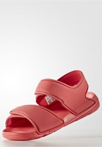 Sandalias rosas con un diseño de dos correas y cierres de Velcro, fabricadas en material sintético suave y con una suela contorneada con surcos texturizados.