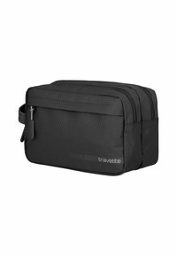 Borsa da viaggio nera con texture esagonale, scomparti con doppia zip, maniglia laterale e logo. Forma rettangolare con cuciture rinforzate.