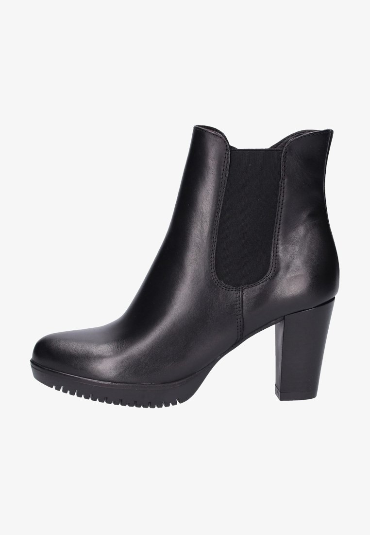 Bottine en cuir noir avec talon bloc et panneau latéral élastique, dotée d'une semelle crantée pour une meilleure adhérence.