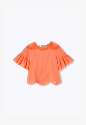 Blouse orange corail avec ourlet festonné, détails floraux brodés, empiècement en dentelle et manches évasées aux trois-quarts.