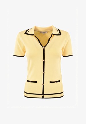 Cardigan jaune à manches courtes avec bordure noire, boutons en perle sur le devant et sur deux petites poches avant, col avec col.
